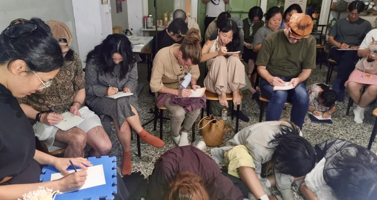 Audience members drawing